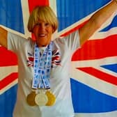 Janet Masters celebrates with her medals