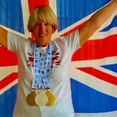 Janet Masters celebrates with her medals