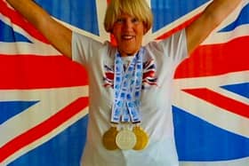 Janet Masters celebrates with her medals