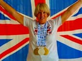 Janet Masters celebrates with her medals