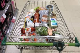 A shopping trolley is pictured at a Waitrose supermarket in London. 