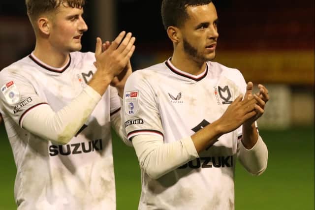 Nathan Holland (right) scored MK Dons’ second goal of the night as they secured top spot in the Papa John’s Trophy group to progress. (Pic Andy Gardner)