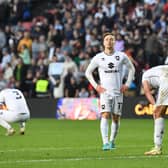 The emotional MK Dons players following their play-off defeat to Wycombe Wanderers back in May. Liam Manning insisted his side are not out for revenge against the Chairboys tomorrow