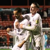 Nathan Holland celebrates with Louie Barry after scoring his first goal for MK Dons on Tuesday against Walsall. Pic: Andy Gardner