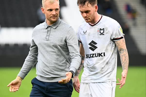 Liam Manning and Josh McEachran in discussion
