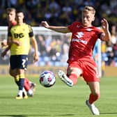 MK Dons midfielder Matt Smith has been included in the Wales squad to go to the World Cup in Qatar