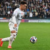 Henry Lawrence in action for MK Dons during the defeat to Derby County