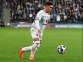 Henry Lawrence in action for MK Dons during the defeat to Derby County