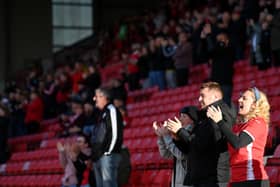 Barnsley fans applaud their team at Oakwell