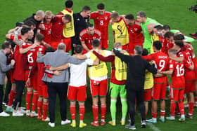Matt Smith with the Wales squad during a team huddle in Qatar