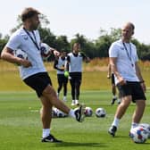 Chris Hogg and Liam Manning on the training ground