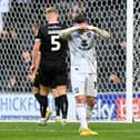 Louie Barry shows his frustration during the game between MK Dons and Burton Albion