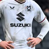 Castore will remain MK Dons’ kit supplier next year, despite their unpopular ‘down and dirty’ shirts this term