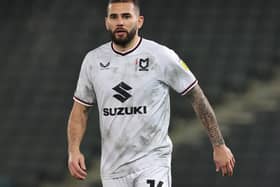 Bradley Johnson will take over as MK Dons caretaker manager for the visit of Leicester City