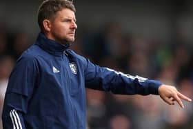 Leeds United coach Mark Jackson has been linked to the vacant MK Dons post
