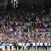 Leeds celebrate with their supporters after avoiding relegation last season. Boss Jesse Marsch credited Mark Jackson, who looks set to take over at MK Dons, with the feat