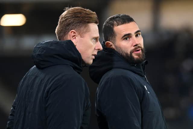 Goalkeeper David Martin and midfielder Bradley Johnson took charge of Dons against Leicester on Tuesday night