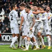 MK Dons celebrate Daniel Harvie’s second goal of the season, coming in the 1-0 win over Forest Green Rovers. It was also Mark Jackson’s first win as a head coach after leaving Leeds last week to take over at Stadium MK