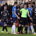 Referee David Rock allowed play to go on after Will Grigg’s shirt was nearly pulled off his back, having earlier booked a Peterborough player for the same foul on Nathan Holland. But play going on allowed the home side to open the scoring