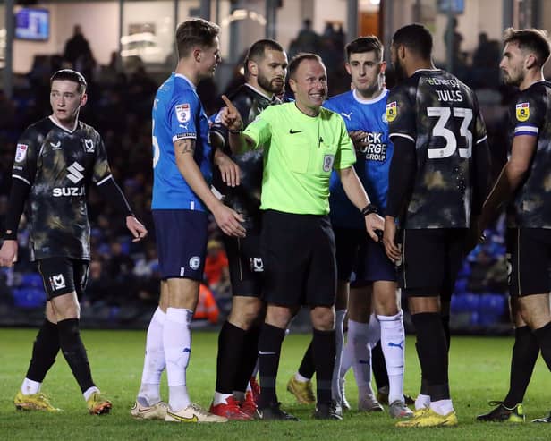 Referee David Rock allowed play to go on after Will Grigg’s shirt was nearly pulled off his back, having earlier booked a Peterborough player for the same foul on Nathan Holland. But play going on allowed the home side to open the scoring