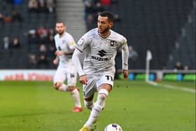 Nathan Holland hopes he can continue to impress new boss Mark Jackson to keep his spot in the MK Dons side