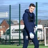 Goalkeeper Jamie Cumming will remain at MK Dons on loan from Chelsea until the end of the season