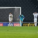The dejected MK Dons players after conceding Shrewsbury’s late winner 