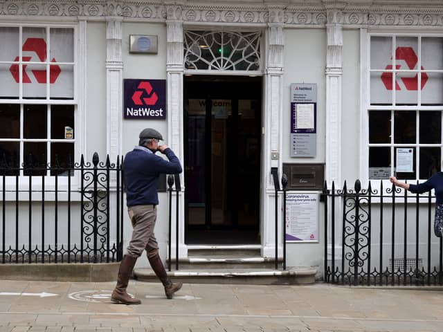 Customers use a NatWest bank on the High Street in Winchester, south west England on March 31, 2021. (Photo by ADRIAN DENNIS / AFP) (Photo by ADRIAN DENNIS/AFP via Getty Images)