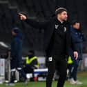Mark Jackson during the 2-0 defeat to Exeter City. The MK Dons head coach has urged his side to tighten up in both penalty areas and to be more ruthless.