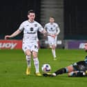 Louie Barry rides a challenge from Forest Green’s Baily Cargill