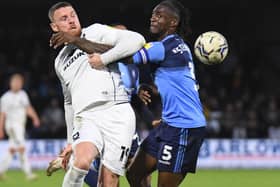 Anthony Stewart scraps with former Dons striker Connor Wickham for Wycombe Wanderers last season