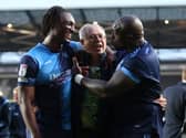 Anthony Stewart and Adebyo Akinfenwa celebrate with Wycombe chairman Rob Couhig