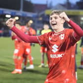 Max Dean celebrates at the full-time whistle after scoring his first professional goal