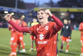 Max Dean celebrates at the full-time whistle after scoring his first professional goal