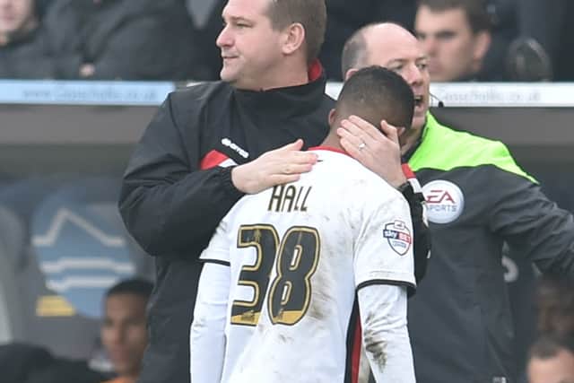 Karl Robinson and Rob Hall remain close despite everything that happened, with the pair reuniting at the Kassam Stadium