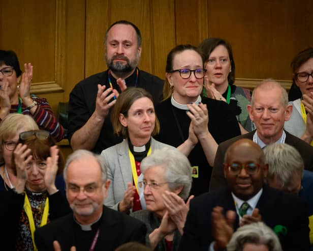 : Members of the General Synod react after blessings for same-sex couples was approved in a vote by the General Synod at The Church House.