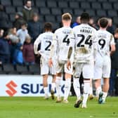 MK Dons leave the pitch following the 1-0 defeat to Ipswich Town