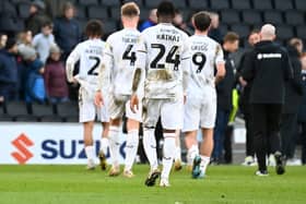 MK Dons leave the pitch following the 1-0 defeat to Ipswich Town