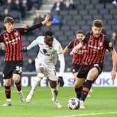 Mo Eisa in action for Dons against Ipswich Town