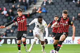 Mo Eisa in action for Dons against Ipswich Town