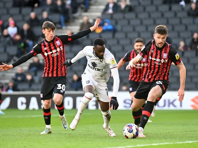Mo Eisa in action for Dons against Ipswich Town