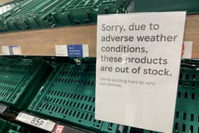 Empty shelves are seen in the fruit and vegetable aisles of a Tesco supermarket on February 22 in Burgess Hill.