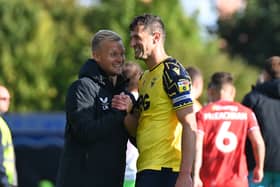 Liam Manning with former Oxford United defender John Mousinho, now manager of Portsmouth