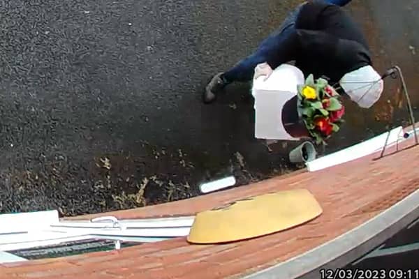 Owner Kim Hughes was left “mortified” when she watched back the footage and saw the hooded man walking off with the box filled with letters to dead relatives. 