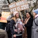 Demonstrators hold placards as they take part in a protest by junior doctors. Picture: NIKLAS HALLE’N/AFP via Getty Images