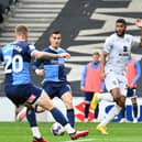 Zak Jules crosses the ball during the game at Stadium MK earlier this season between MK Dons and Wycombe Wanderers