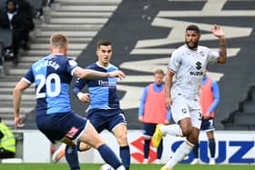 Zak Jules crosses the ball during the game at Stadium MK earlier this season between MK Dons and Wycombe Wanderers