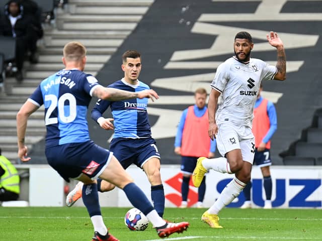 Zak Jules crosses the ball during the game at Stadium MK earlier this season between MK Dons and Wycombe Wanderers