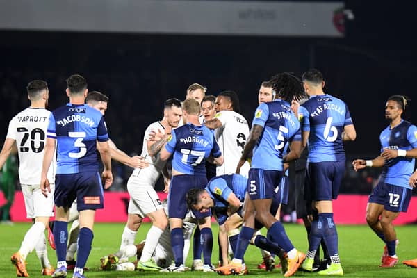Tempers flares in both games between Dons and Wycombe at Adams Park last season