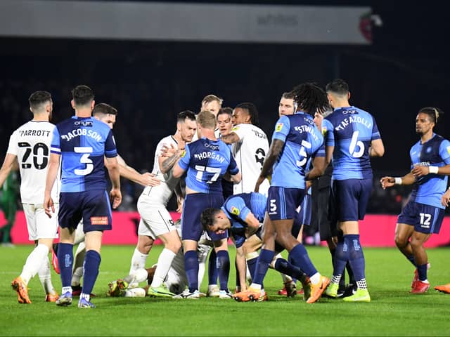 Tempers flares in both games between Dons and Wycombe at Adams Park last season